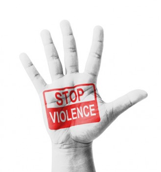 Open hand raised, Stop Violence sign painted